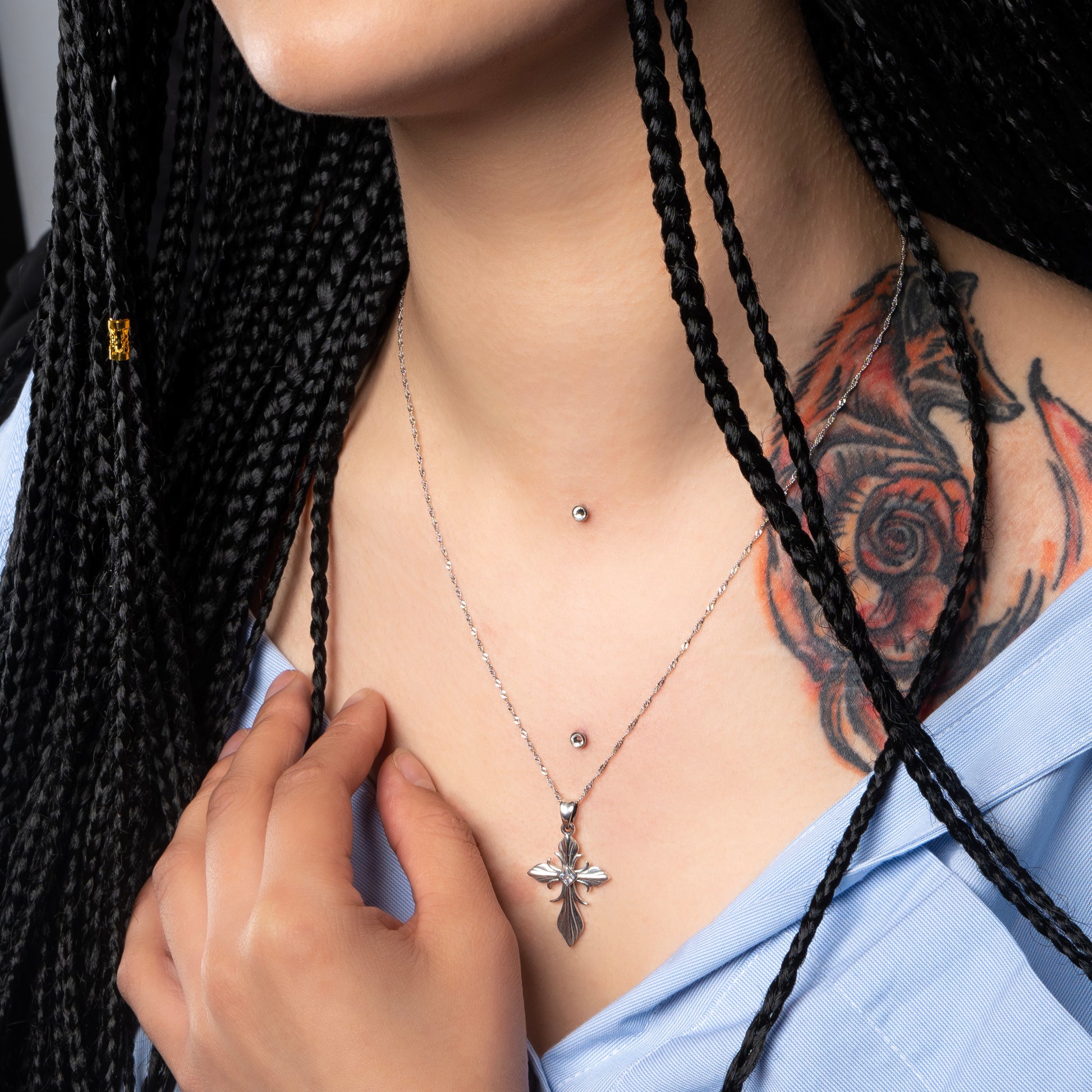 Model wearing Tribal Cross Silver Pendant with Water Wave necklace.