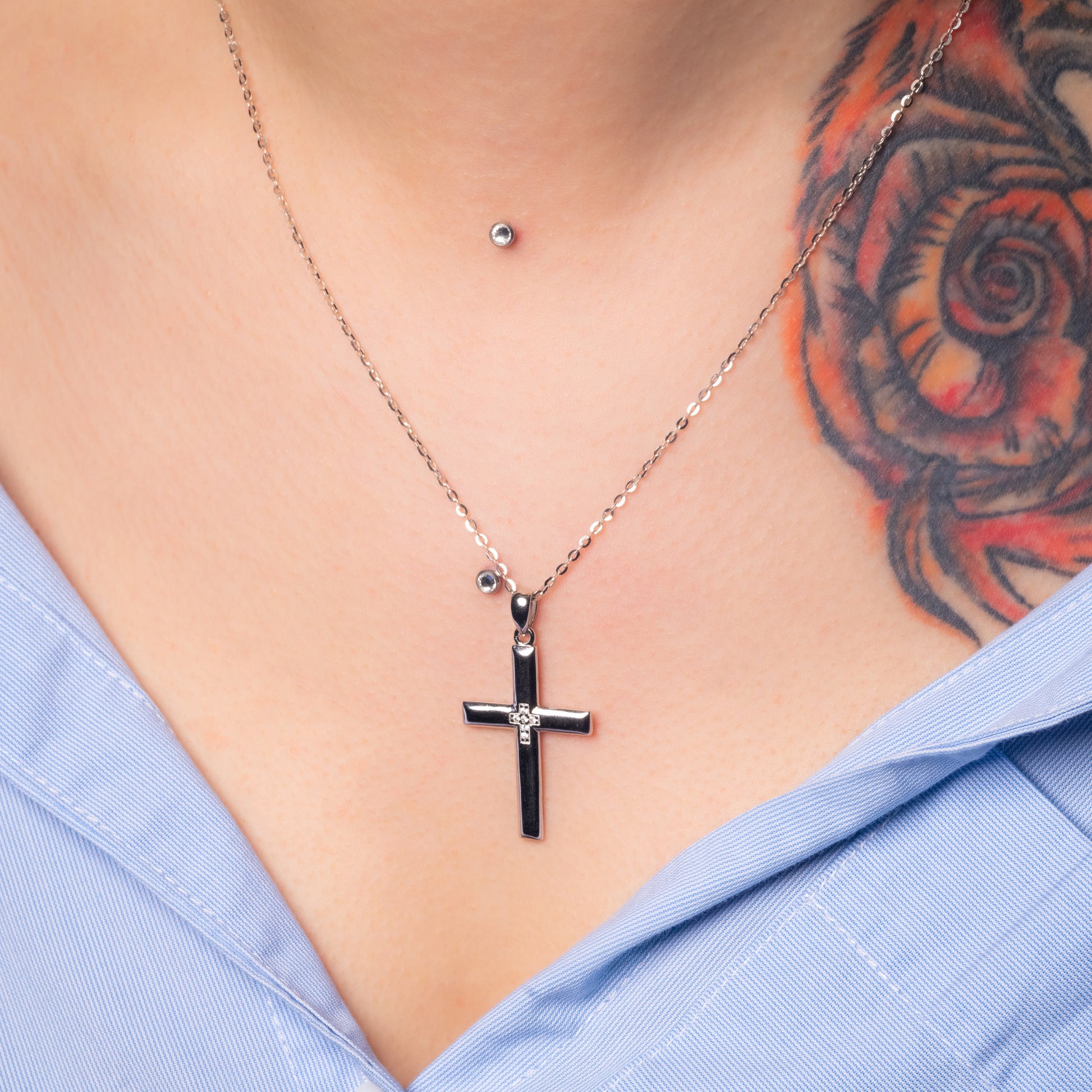 Model wearing Christian Cross Silver Pendant with Flat Cable necklace. Zoomed view.