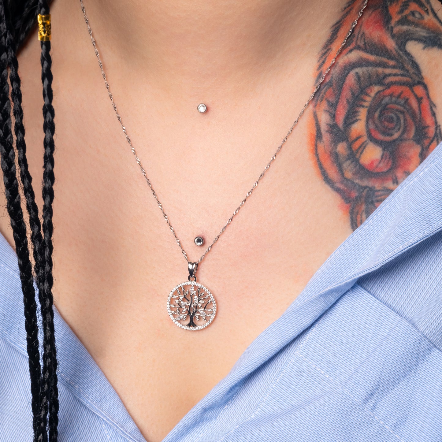 Model wearing Iced Tree of Life Silver Pendant with Water Wave Necklace. Zoomed-in view.