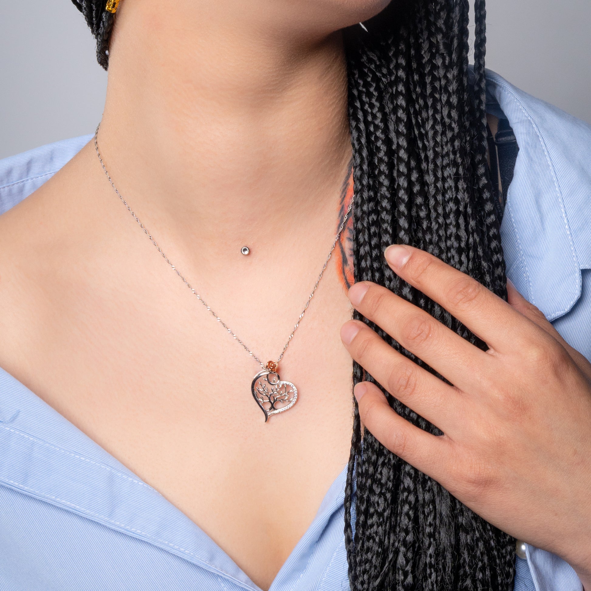 Model wearing Tree of Life Heart Silver Pendant with Water Wave necklace.