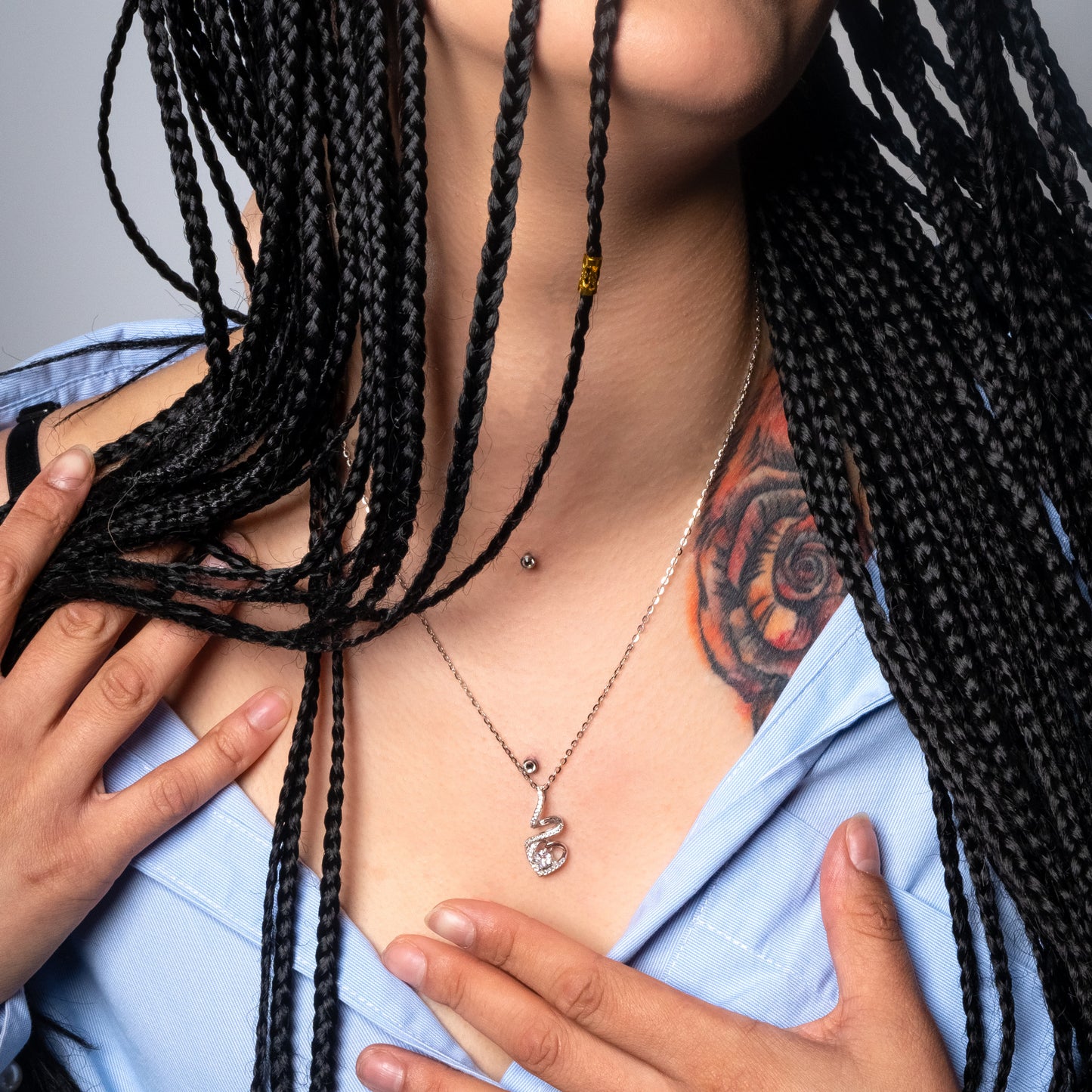 Model wearing Solitaire Heart Crystal Silver Pendant with Flat Cable necklace.