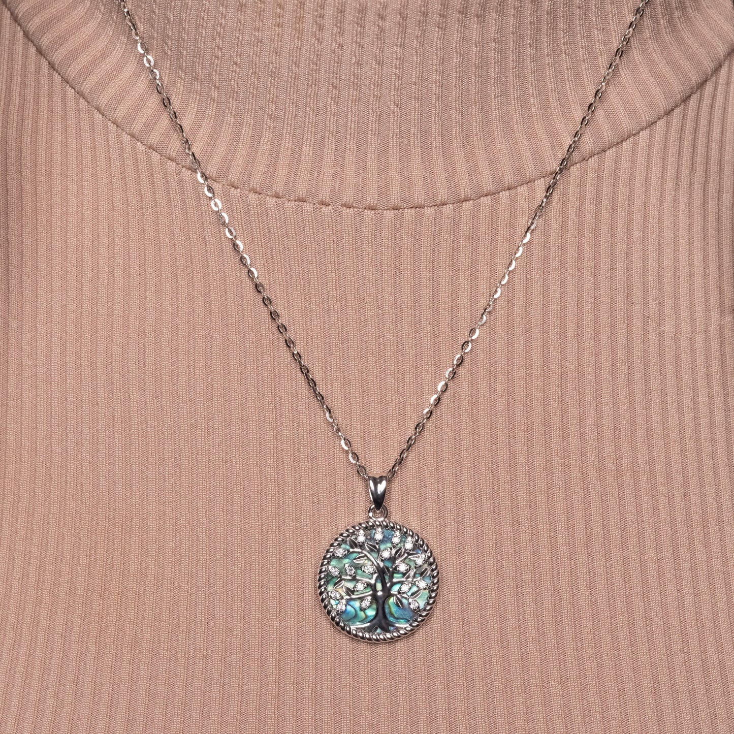 Crystal Tree of Life Abalone Shell Pendant paired with Flat Cable necklace on the model
