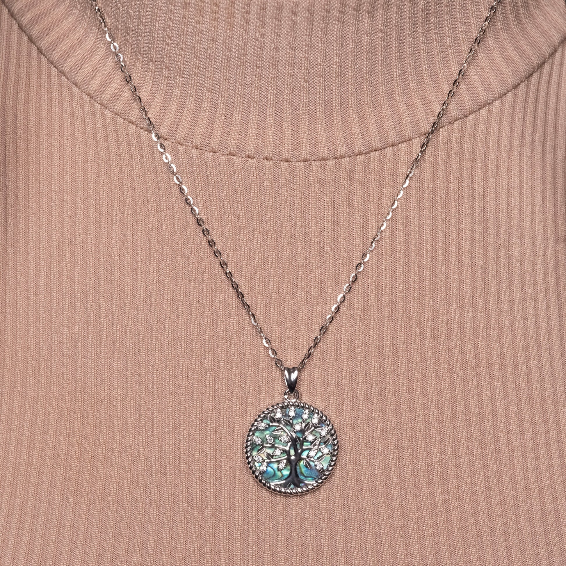 Crystal Tree of Life Abalone Shell Pendant paired with Flat Cable necklace on the model