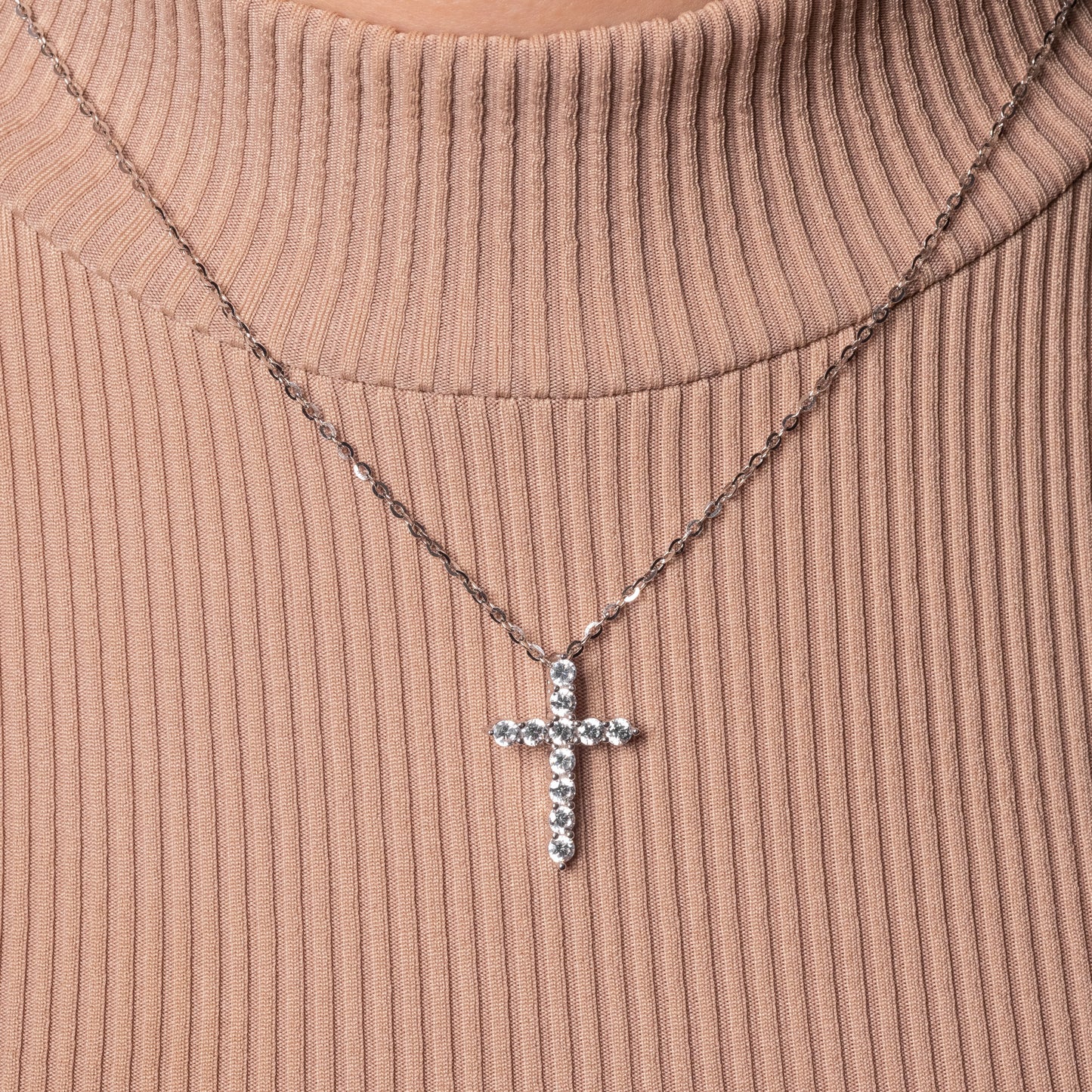 Iced Cross Pendant paired with Flat Cable necklace on the model. Zoomed.