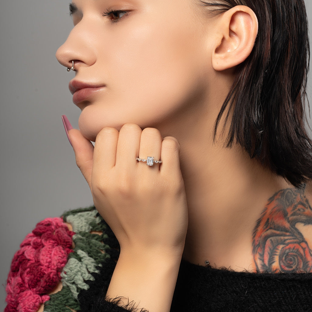 A model wearing Baguette Cut Cubic Zirconia 925 Sterling Silver Ring on her finger.