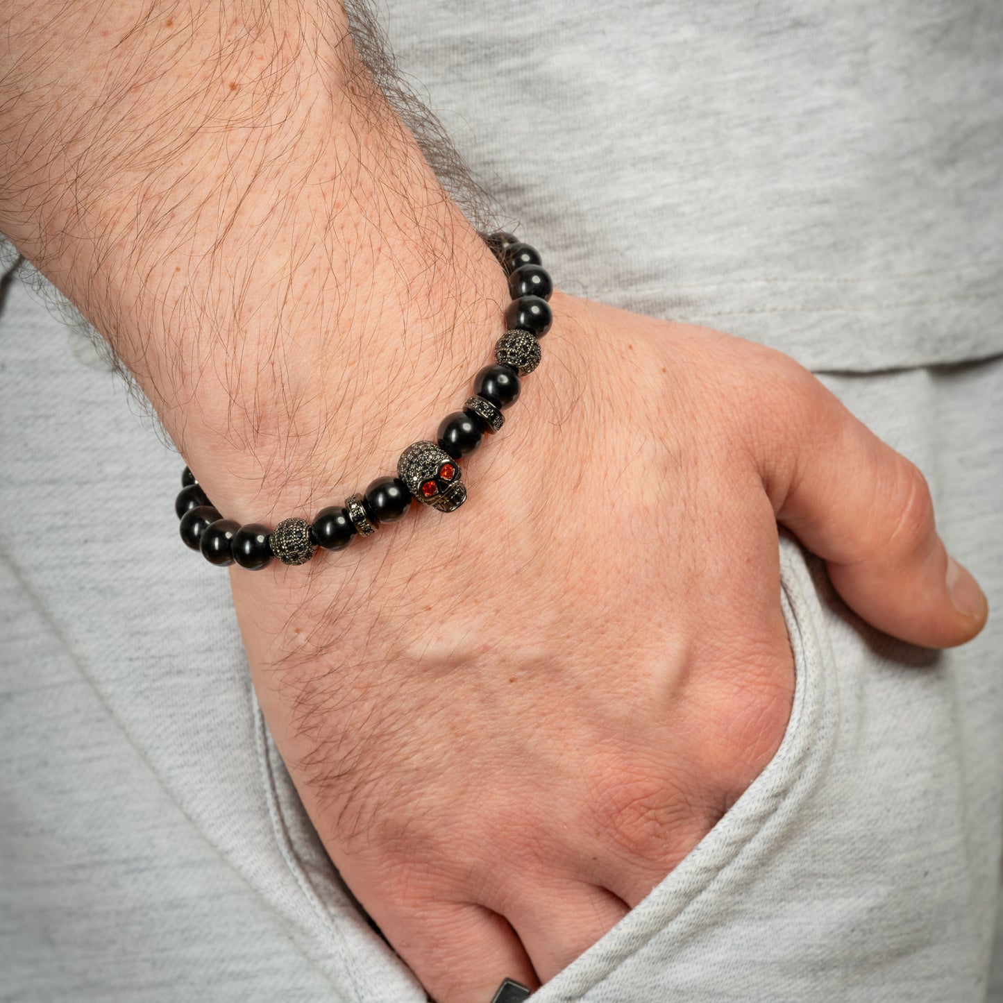 Model wearing Black Agate Skull bracelet in Black.