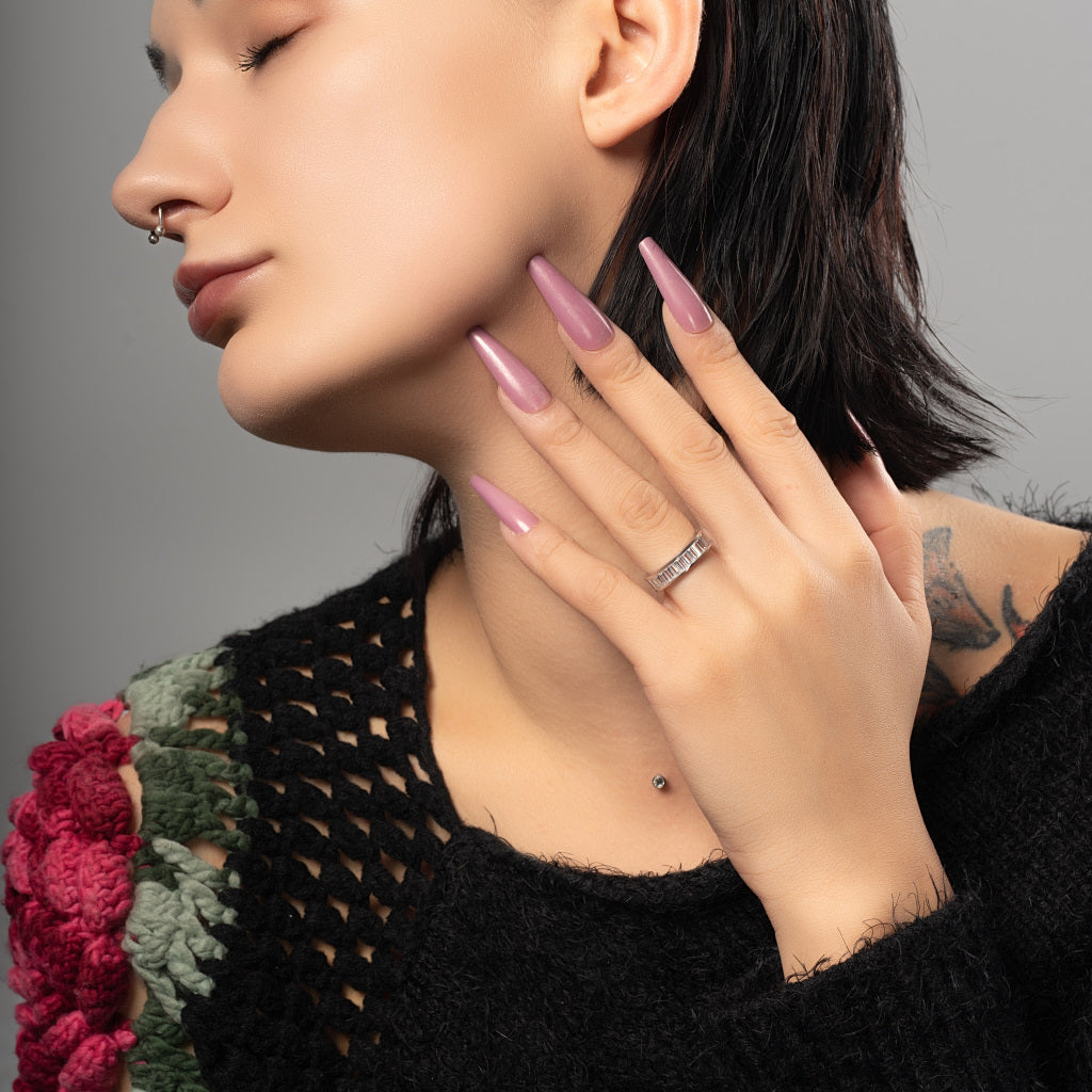 A female model wearing Cubic Zirconia Baguette cut 925 Sterling Silver Band Ring.