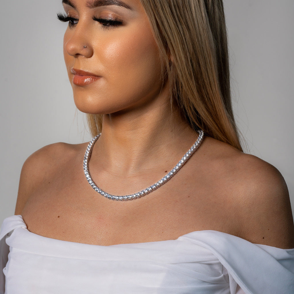 Female model in white dress wearing Cubic Zirconia 5mm Silver Tennis Necklace Tarnish-free