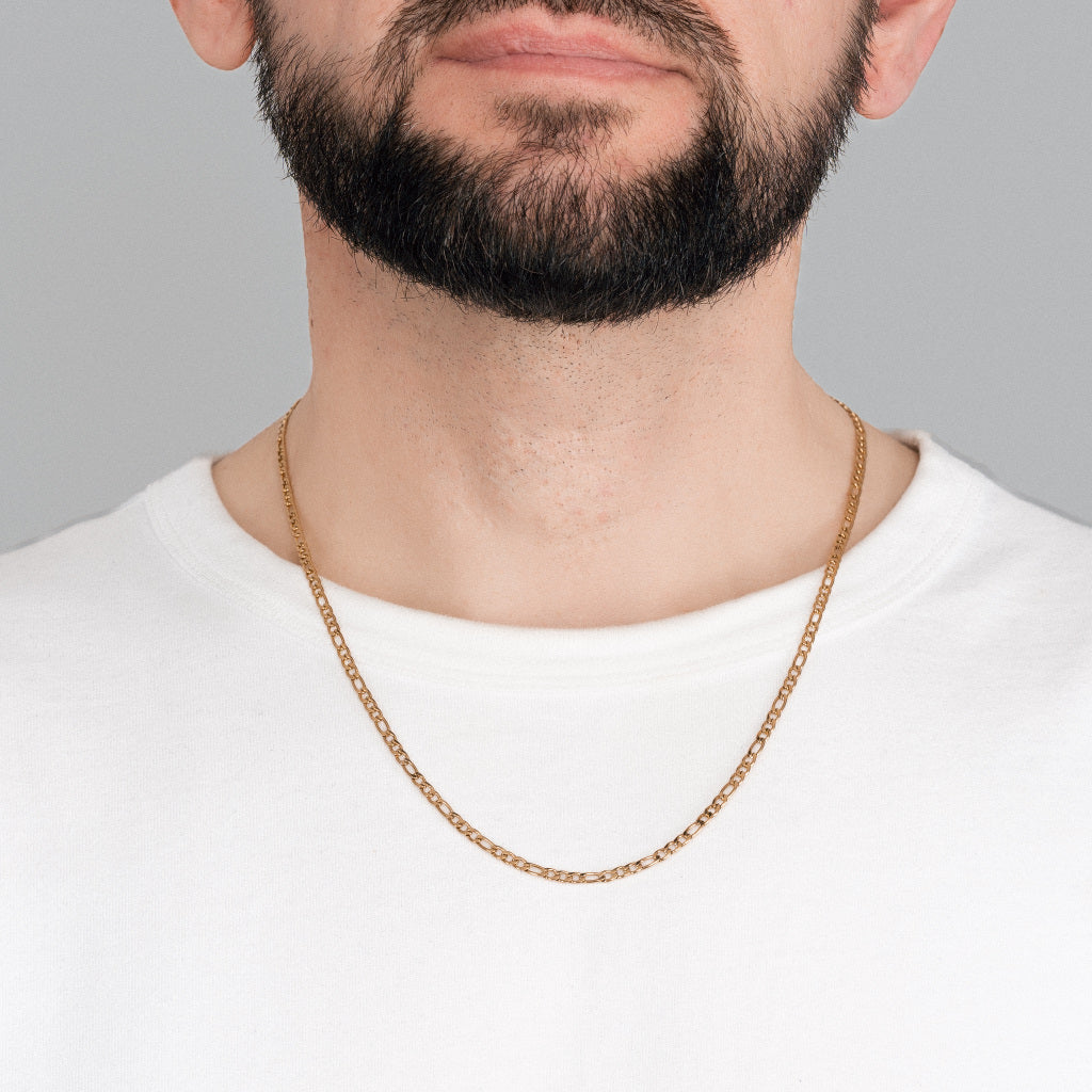 A bearded man in white t-shirt wearing Gold Figaro Chain 3mm, 55cm, lifetime stainless steel men's jewellery