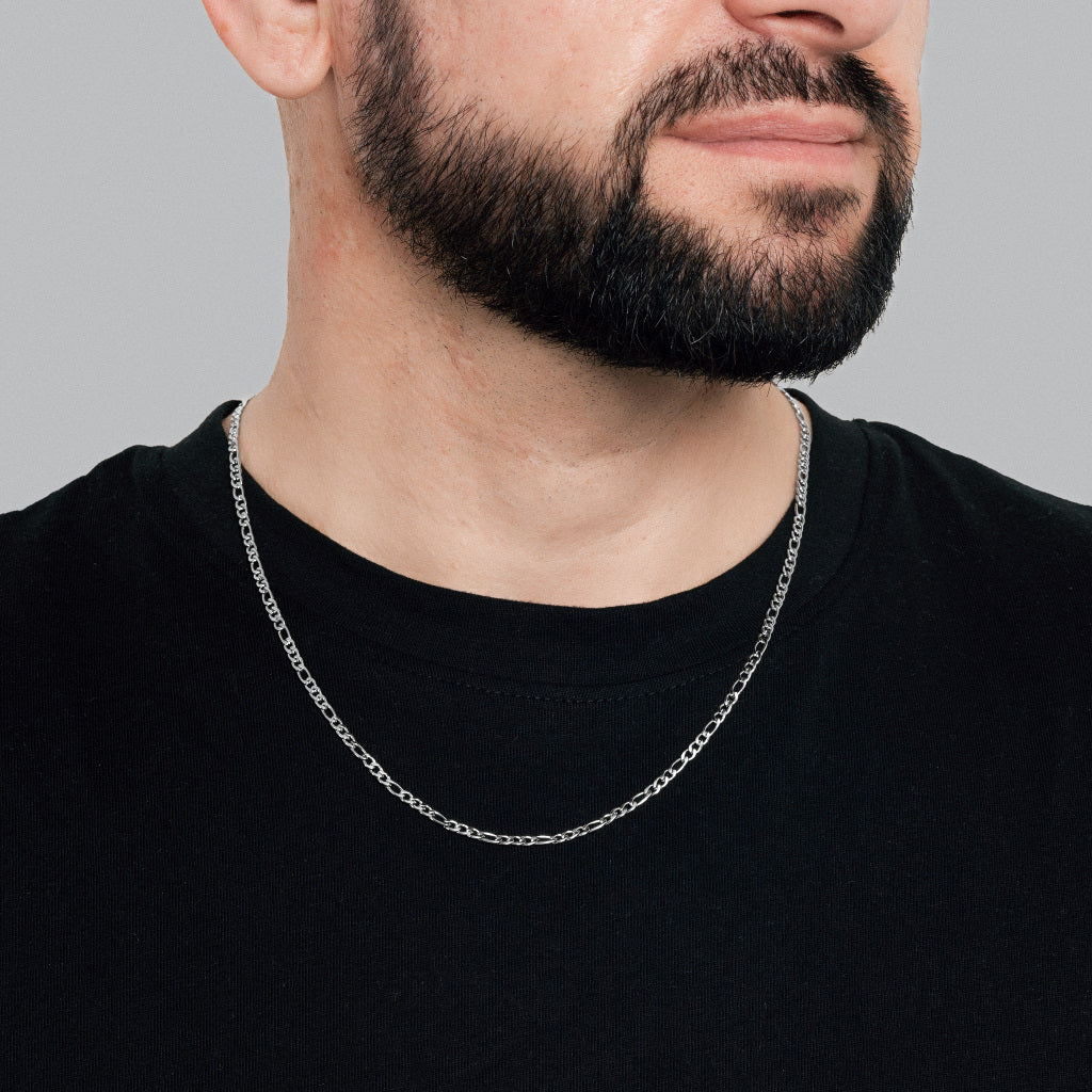 A bearded man in black t-shirt wearing Silver Figaro Link Chain 3mm, waterproof lifetime men's jewellery