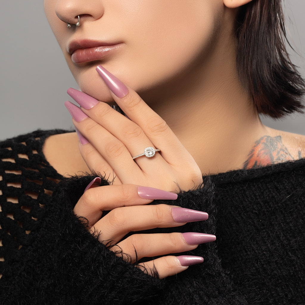 A female model wearing Halo Round cut Cubic Zirconia 925 Sterling Silver ring on her finger.