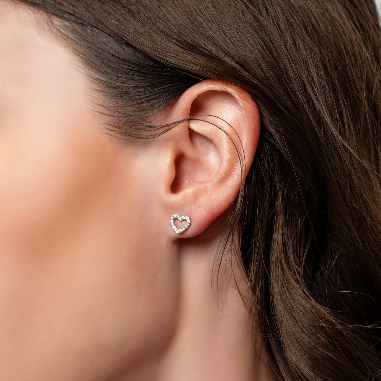 A model showing Love Heart earring in her ear