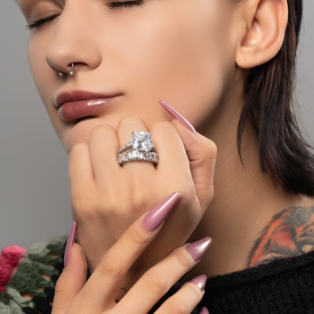 A model wearing Asscher cut Cubic Zirconia 925 Sterling Silver stackable ring band on her finger.