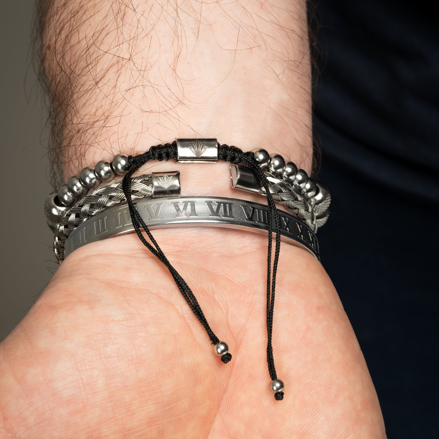 Model wearing Roman Royal King Bracelet Set on his wrist. Back side.