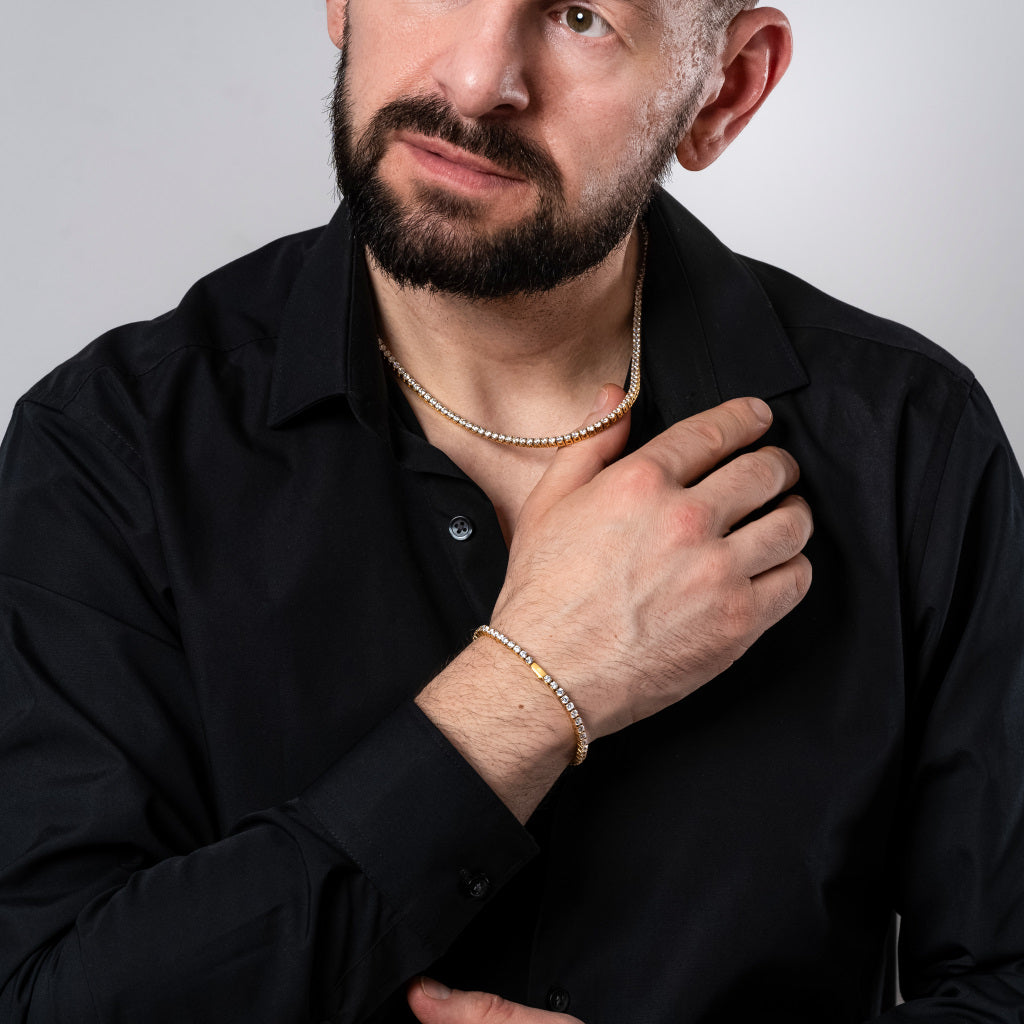 Male model in black shirt wearing Cubic Zirconia 3mm Gold Tennis Necklace and Bracelet set