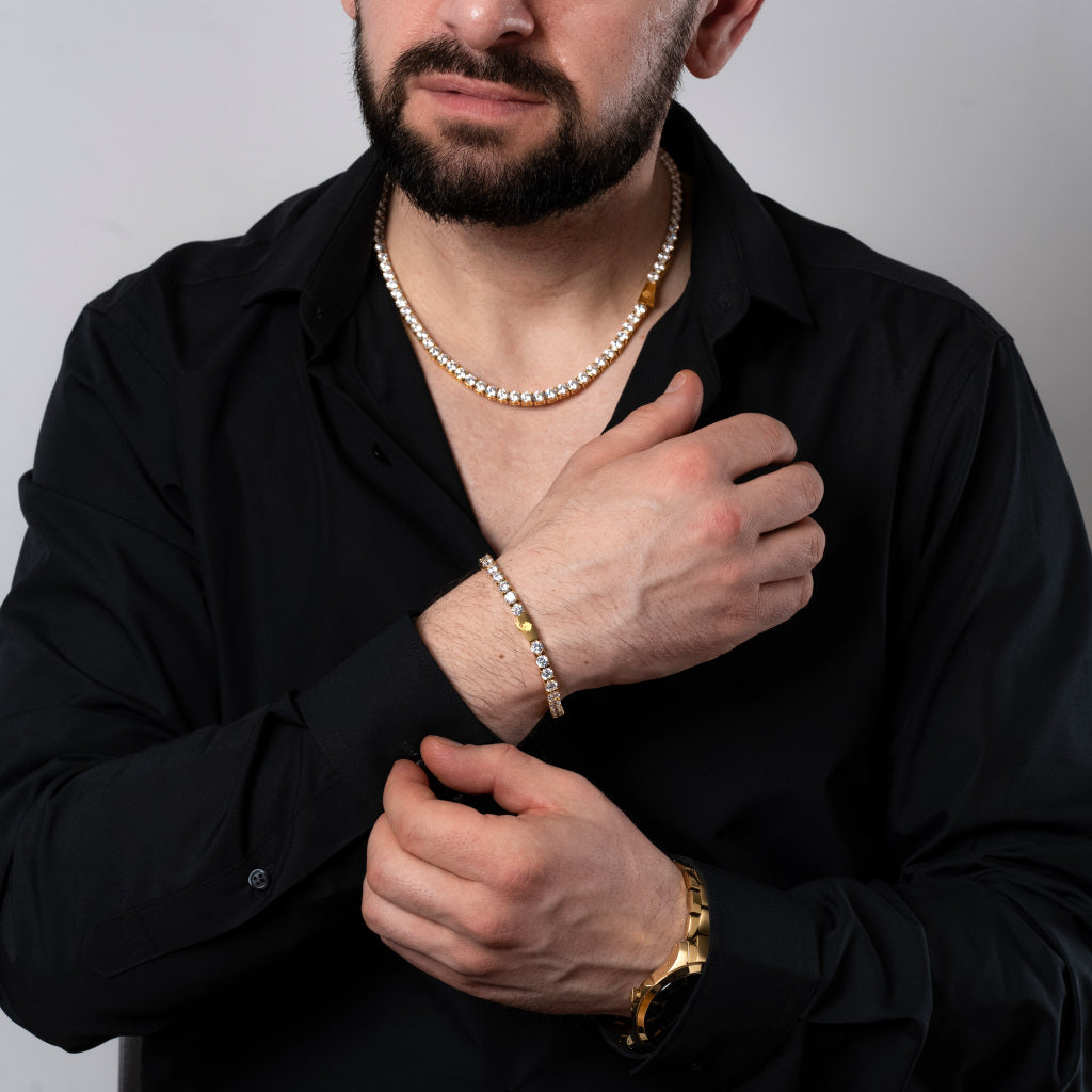 Male model in black shirt wearing Cubic Zirconia 5mm Gold Tennis Necklace and Bracelet set