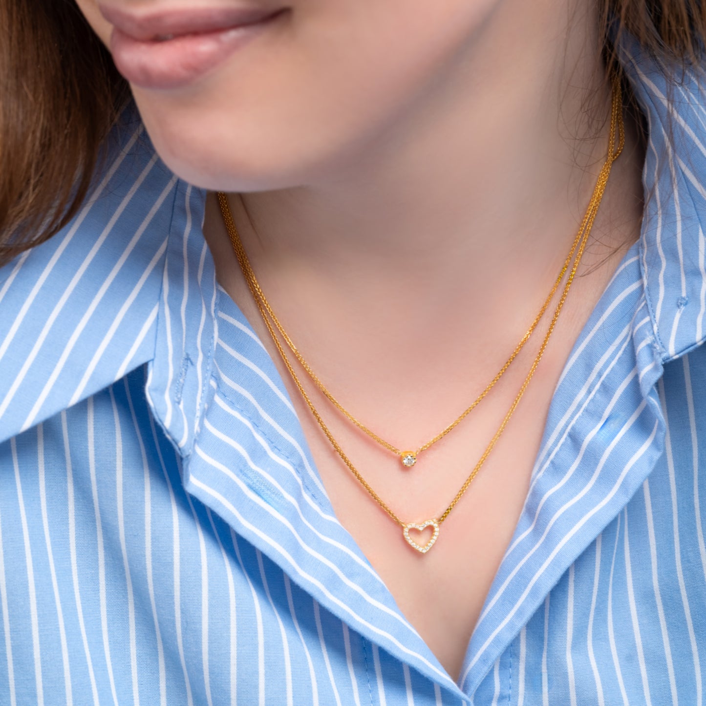 A model wearing Love Heart Gold Necklace