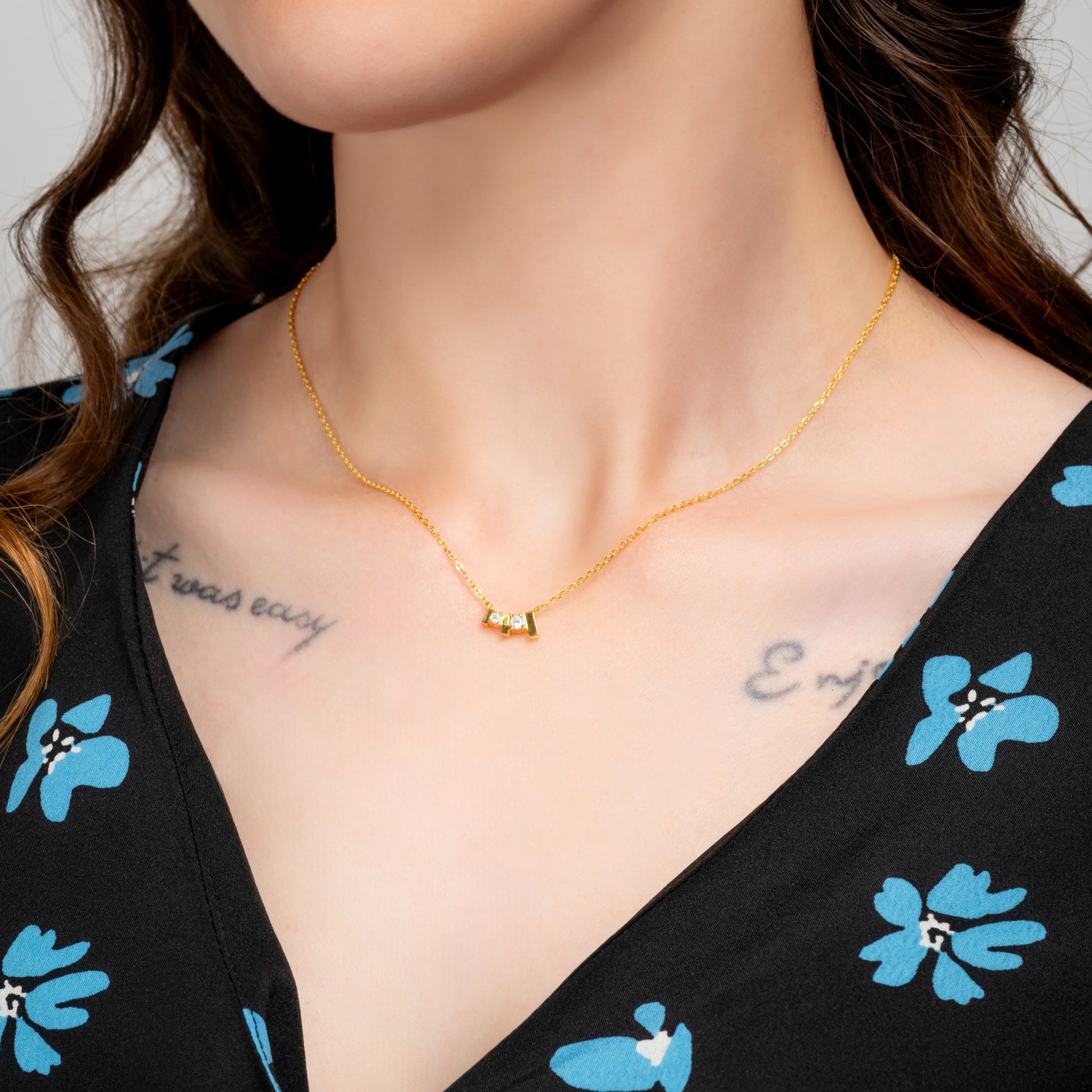 Model wearing Trilogy Gold Necklace on her neck