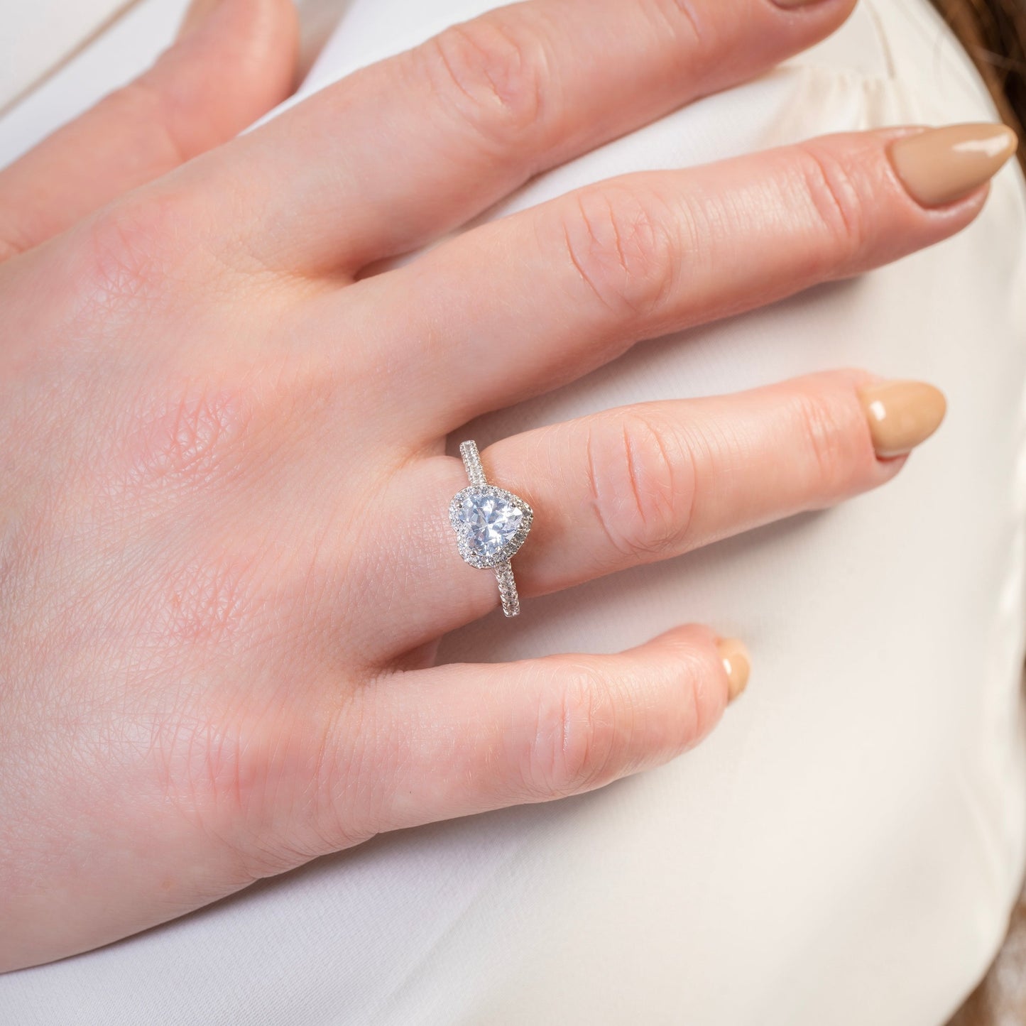 Marry Me Love Heart Engagement Ring on the models finger