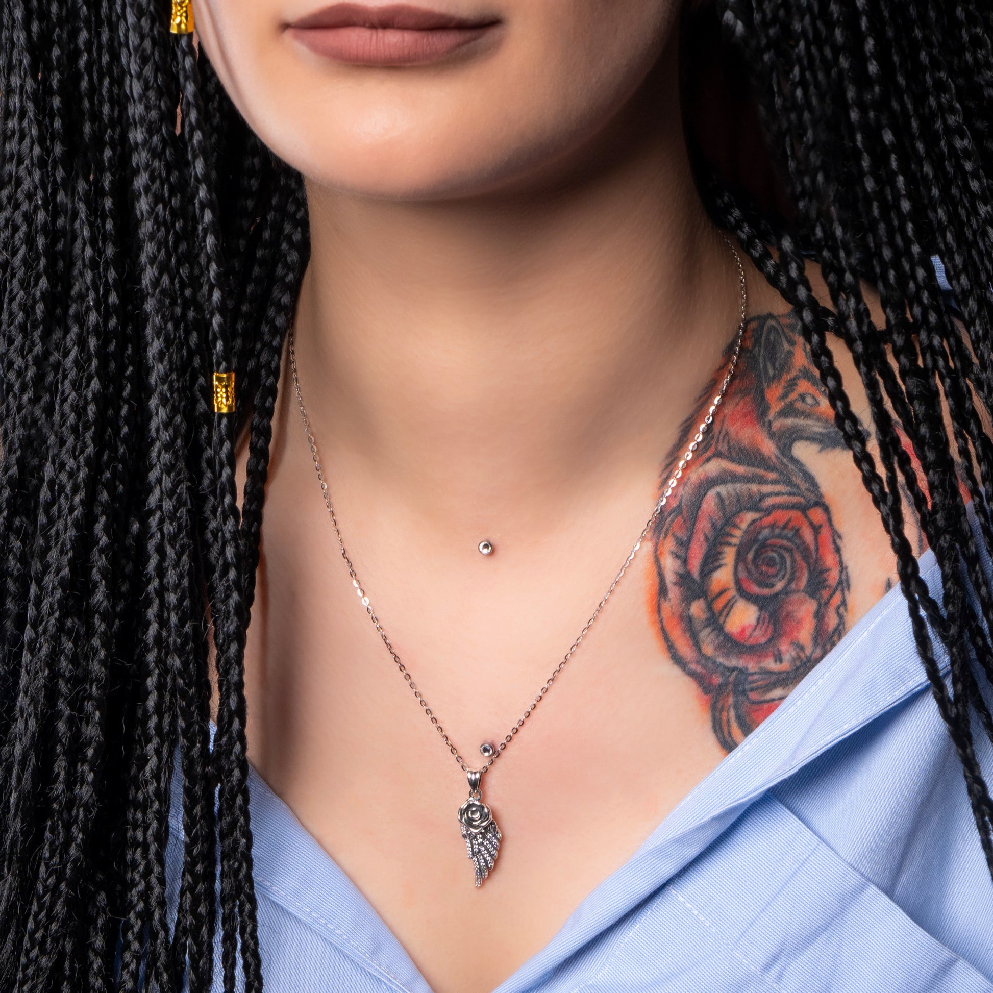 Model wearing Rose Angel Wing Silver Pendant with Flat Cable necklace.