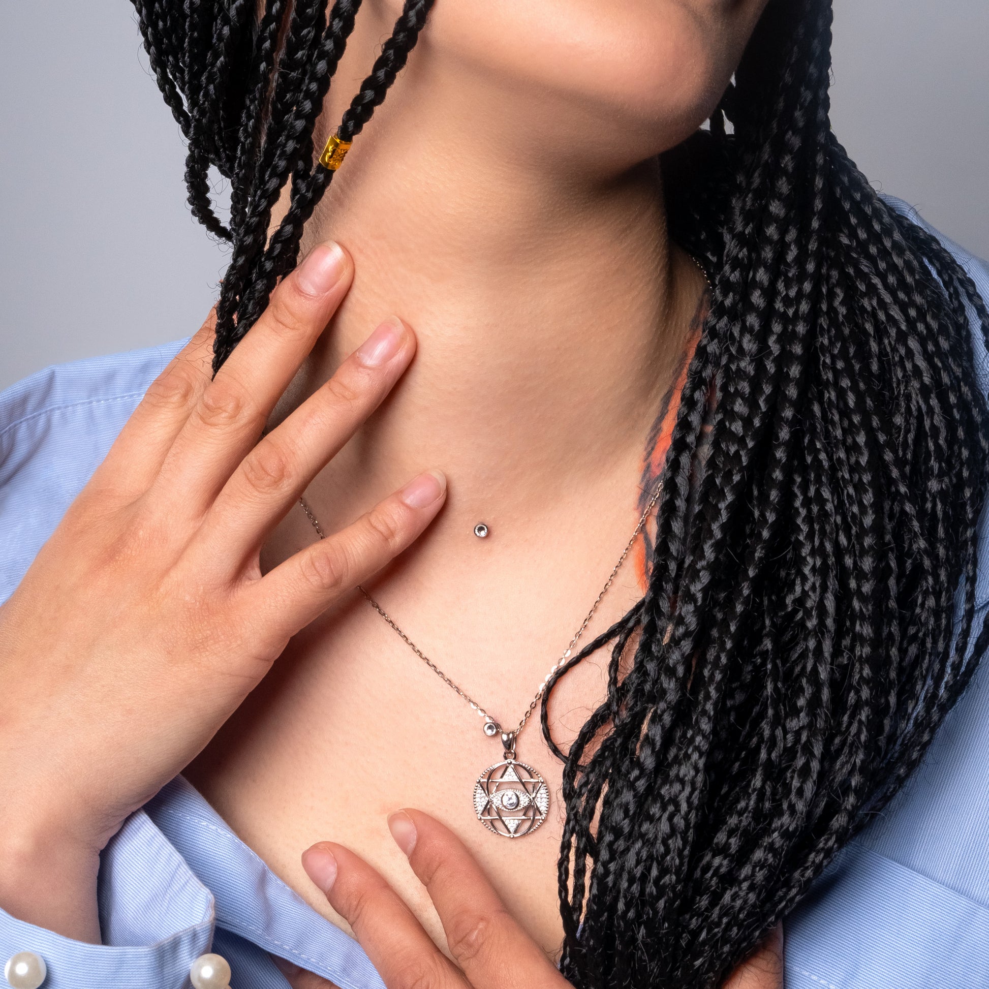 Model wearing Iced Evil Eye Pendant with Flat Cable necklace.