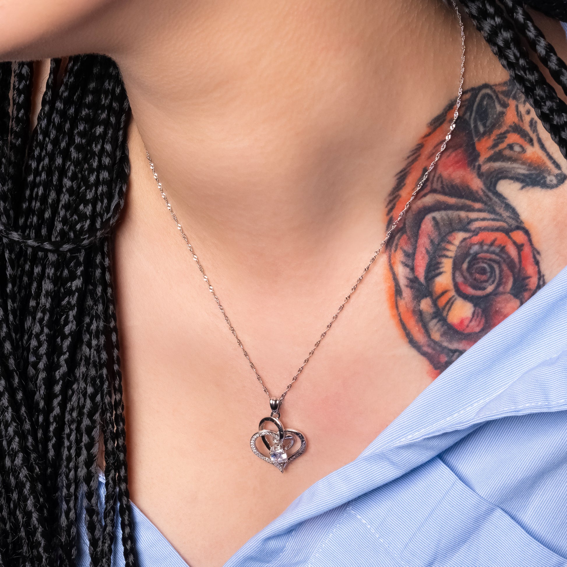 Tatooed Model wearing Twin Love Heart Engraved Pendant paired with Water Wave necklace