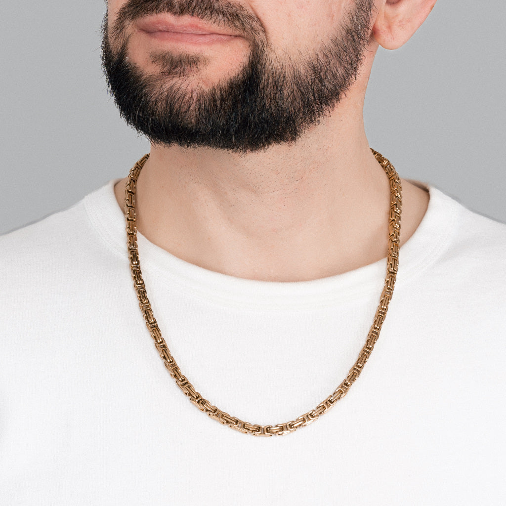 A bearded man in white t-shirt wearing Gold Byzantine Box link Chain 5mm, 24 inches, lifetime stainless steel men's jewellery