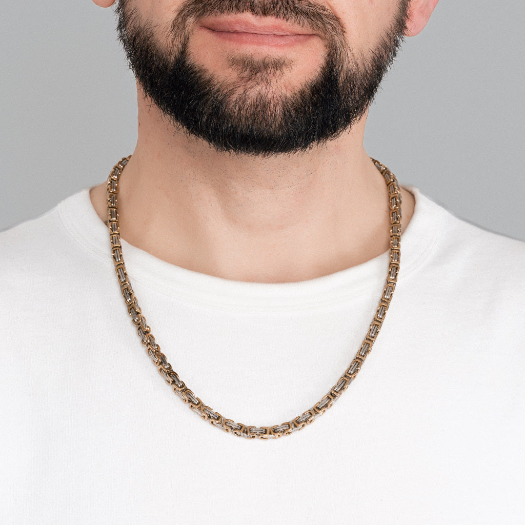 A bearded man in white t-shirt wearing 2 tone Gold Silver Byzantine Box link Chain 5mm, 24 inches, lifetime stainless steel men's jewellery