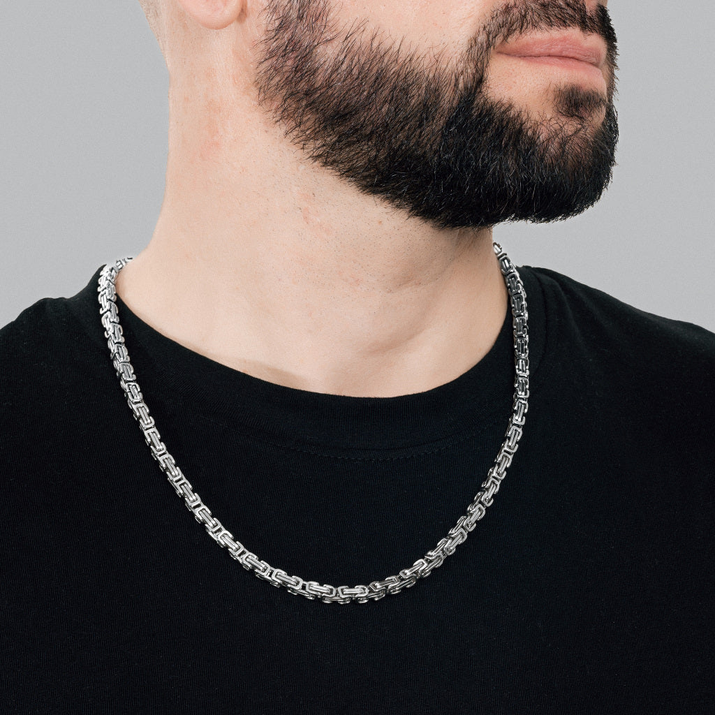 A bearded man in black t-shirt wearing Silver Byzantine Box link Chain 5mm, 24 inches, luxury lifetime stainless steel men's jewellery