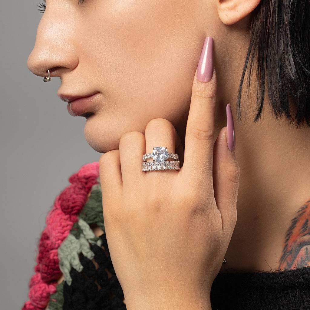 A model wearing Cushion Cut 5A Cubic Zirconia 925 Sterling Silver Ring Band Stackable Set on her middle finger