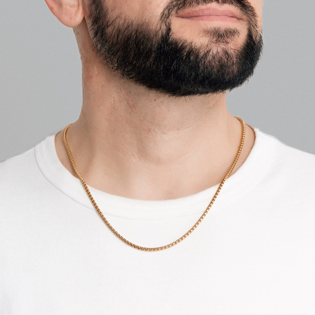 A bearded male model in white t-shirt wearing Gold Round Box link Chain 3mm, 22 inches, lifetime stainless steel men's jewellery