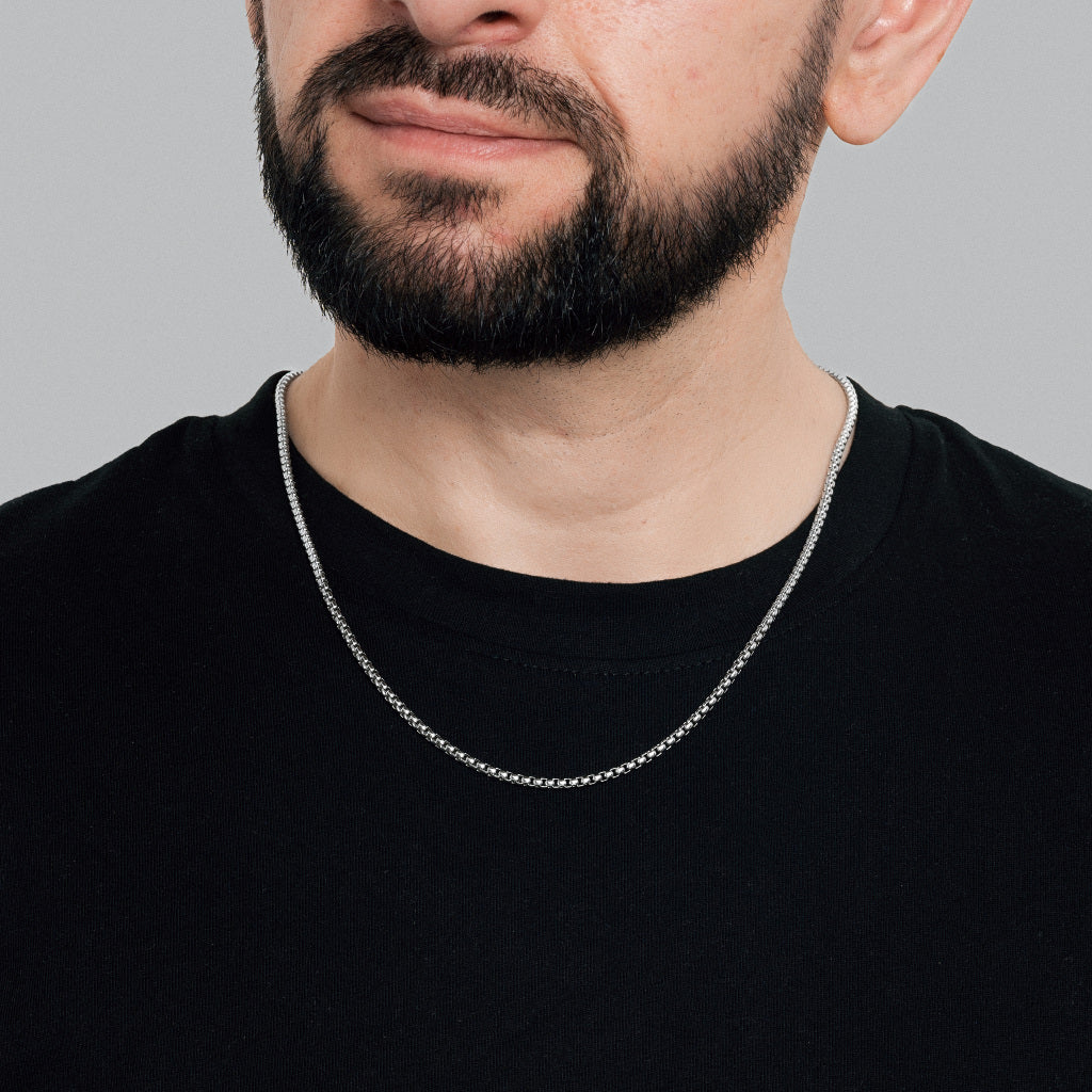 A bearded male model in black t-shirt wearing Silver Round Box link Chain 3mm, 22 inches, lifetime, tarnish free, stainless steel men's jewellery