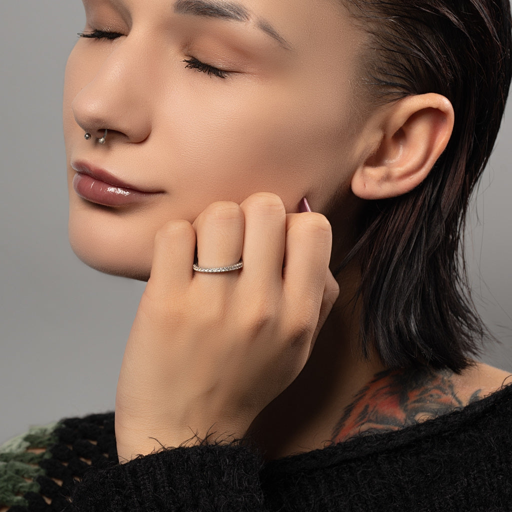 A female model wearing Half Eternity Cubic Zirconia 925 Sterling Silver Ring on her ring finger.