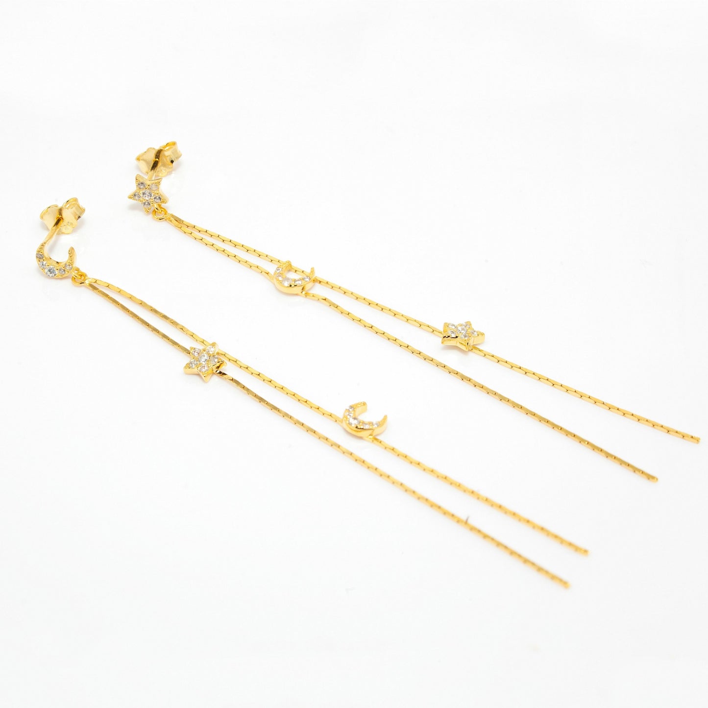 Moon and Star Gold Drop Earrings lying down view