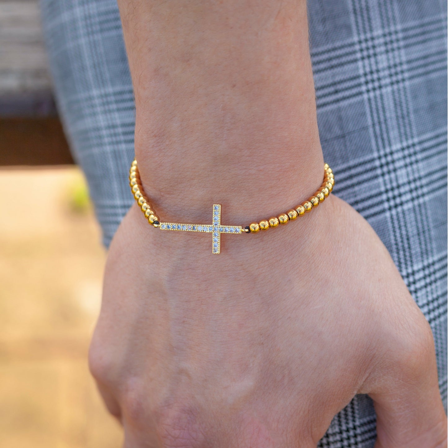 Cross Gemstone Bracelet in Gold on wrist view