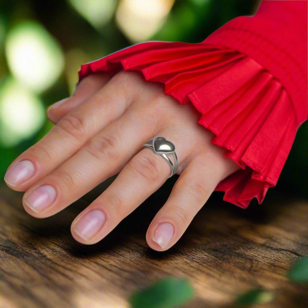 Love Heart Silver Ring on a woman's finger